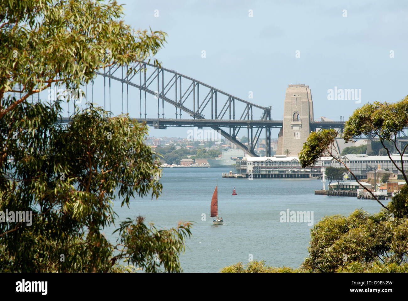 A daytime view of Sydney Harbour Bridge behind gum trees Stock Photo