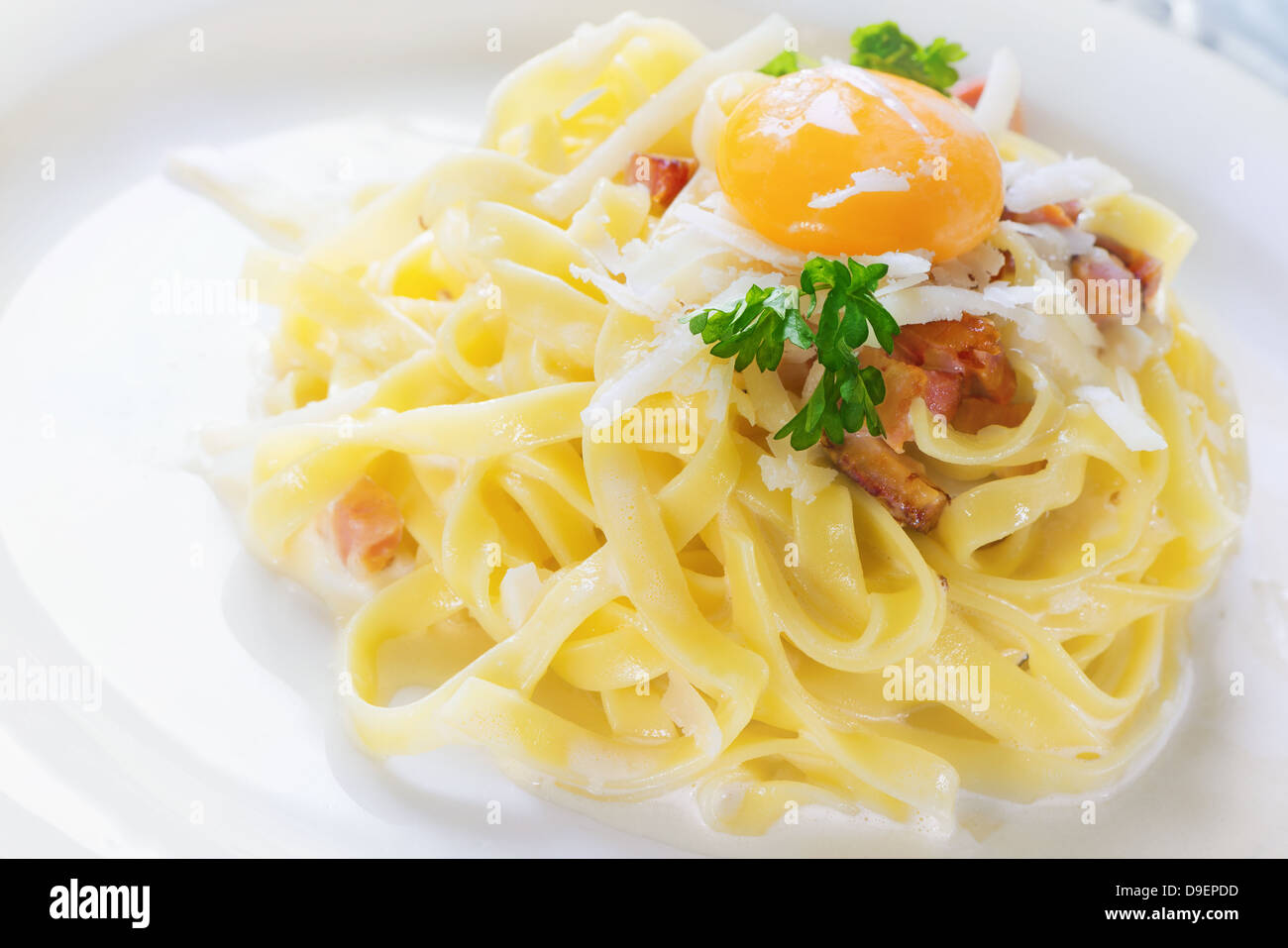 Pasta Carbonara Tagliatelle with egg yolk, parsley and parmesan Stock