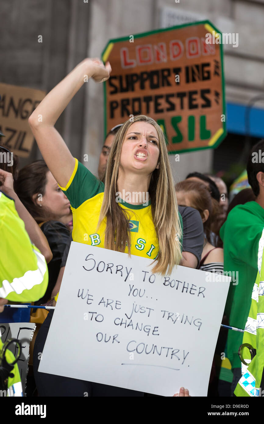 London, UK. 18th June, 2013. Thousands converge on Westminster, London, to show their support for the demonstrations happening in major Cities across Brazil. Growing numbers are joining the Brazilian demonstrations, the largest the country has seen in 20 years. Protesters are united over a wide range of issues from Fare increases and Tax rises to inequality, education and the large sums of money being spent on the forthcoming 2014 World Cup. Credit:  Brendan Bell/Alamy Live News Stock Photo