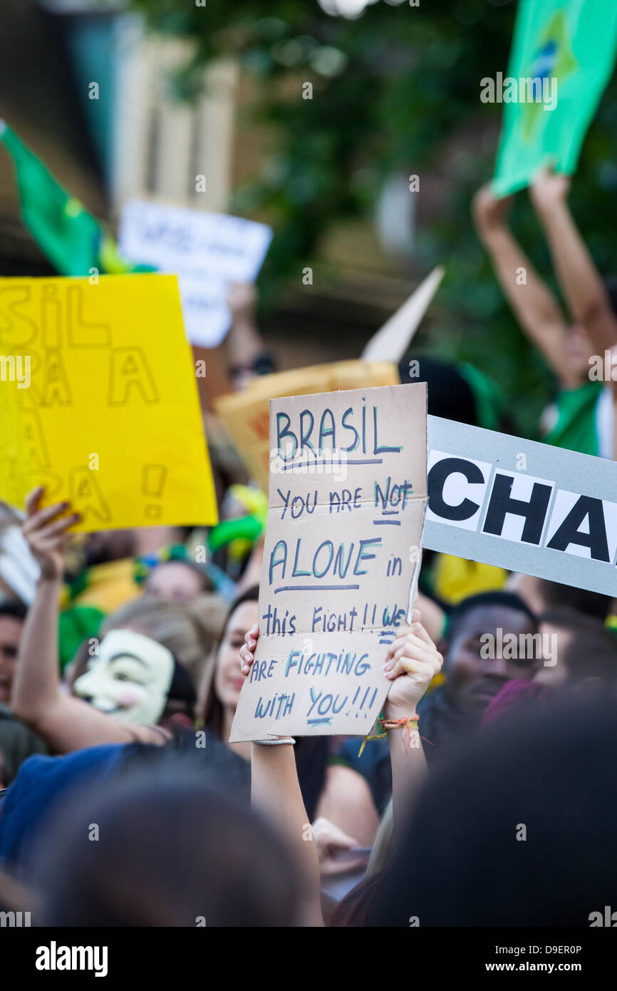 London, UK. 18th June, 2013. Thousands converge on Westminster, London, to show their support for the demonstrations happening in major Cities across Brazil. Growing numbers are joining the Brazilian demonstrations, the largest the country has seen in 20 years. Protesters are united over a wide range of issues from Fare increases and Tax rises to inequality, education and the large sums of money being spent on the forthcoming 2014 World Cup. Credit:  Brendan Bell/Alamy Live News Stock Photo