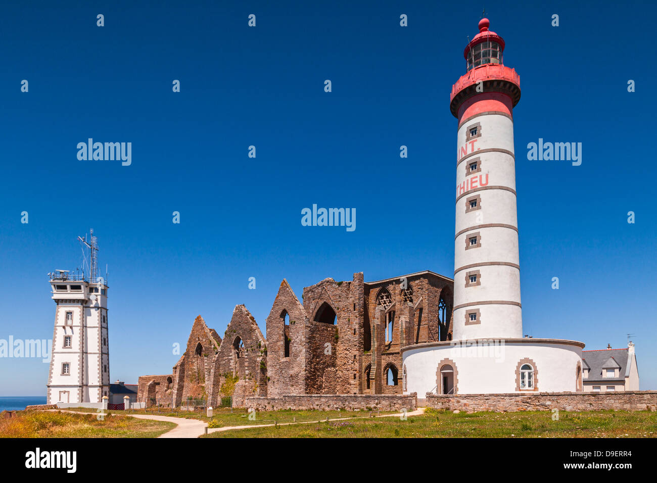 Lighthouse, signal station and ruined abbey on the headland of Pointe Saint-Mathieu in Brittany, France. Stock Photo