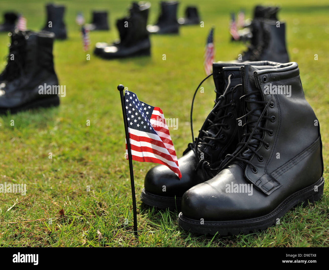 Combat boots are placed in formation representing America's POW/MIA. Stock Photo