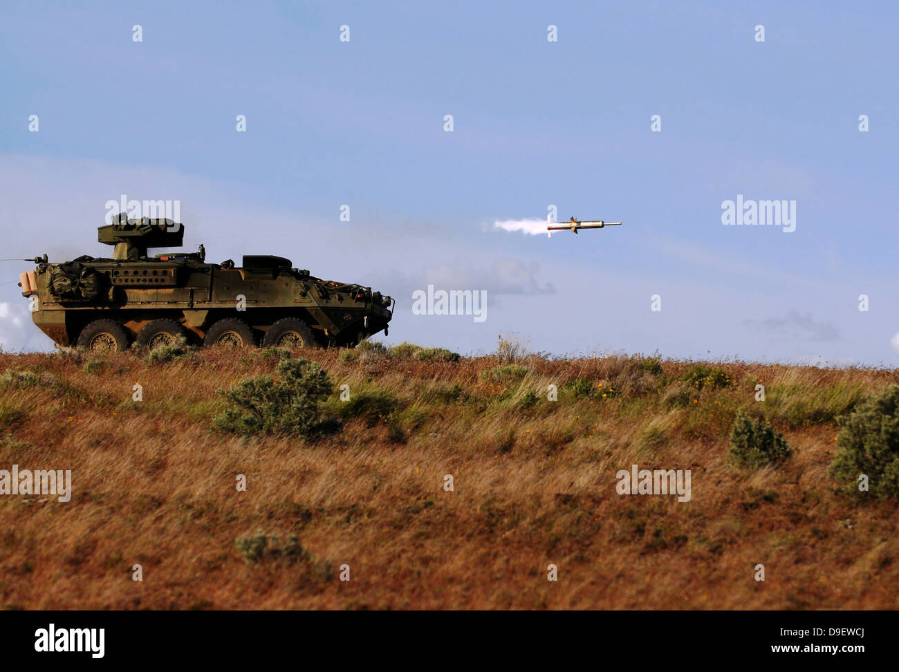 A TOW missile is launched from an armored vehicle. Stock Photo