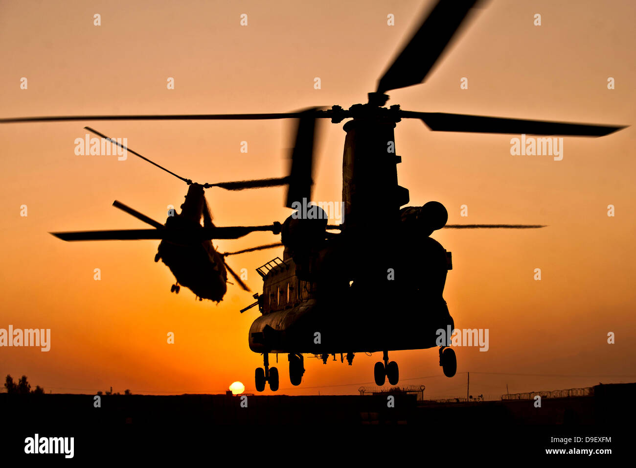 Two Royal Air Force CH-47 Chinooks take off from headquarters in Afghanistan Stock Photo
