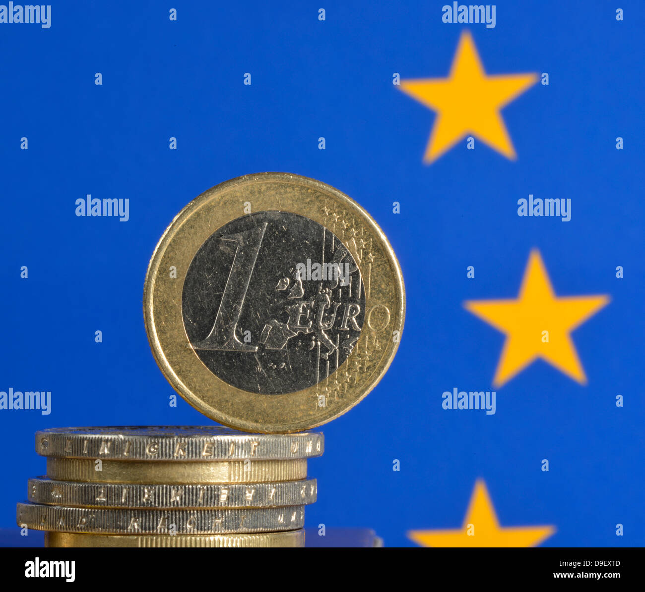 Euro-crisis, coins, European flag Stock Photo