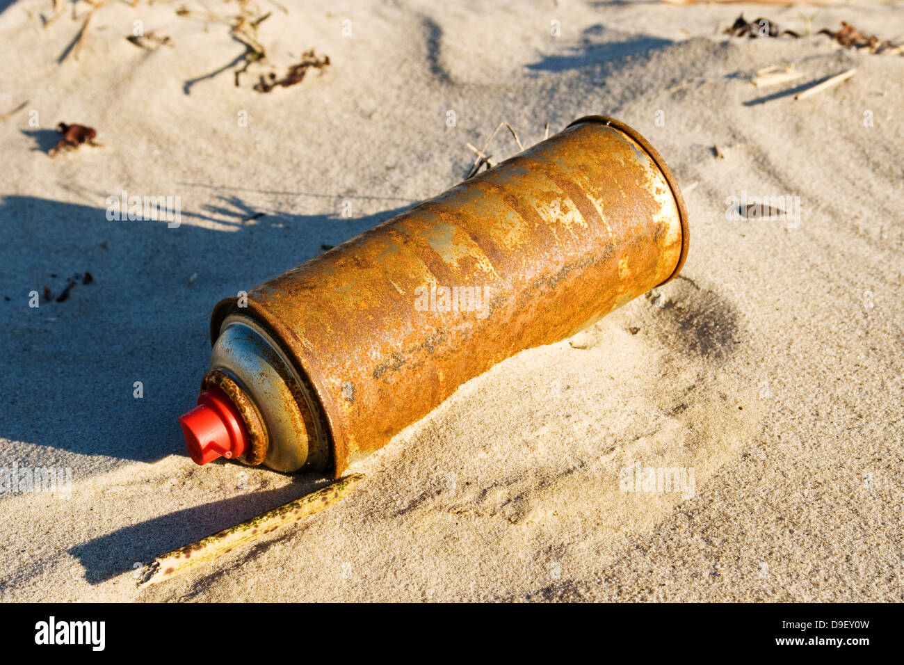 Old spray can on a beach by the North Sea, Old ?rosol on a beach At the North Sea Stock Photo
