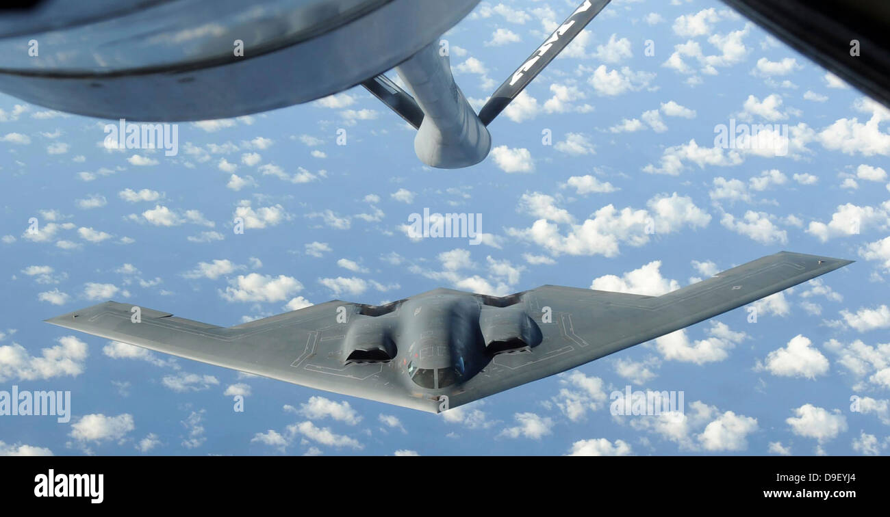 A B-2 Spirit approaches the refueling boom of a KC-135 Stratotanker. Stock Photo