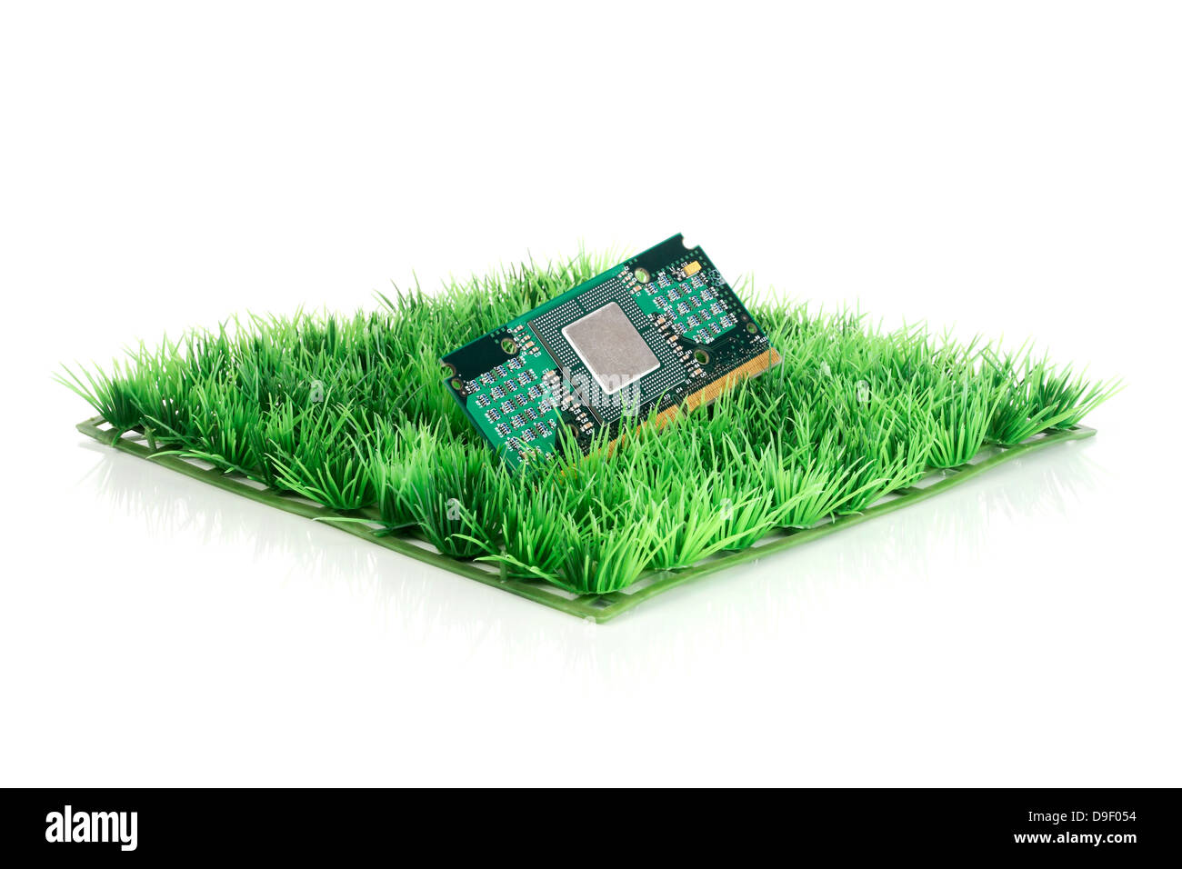 To platinum with processor base on art lawn Board with processor socket on synthetic Grass Stock Photo