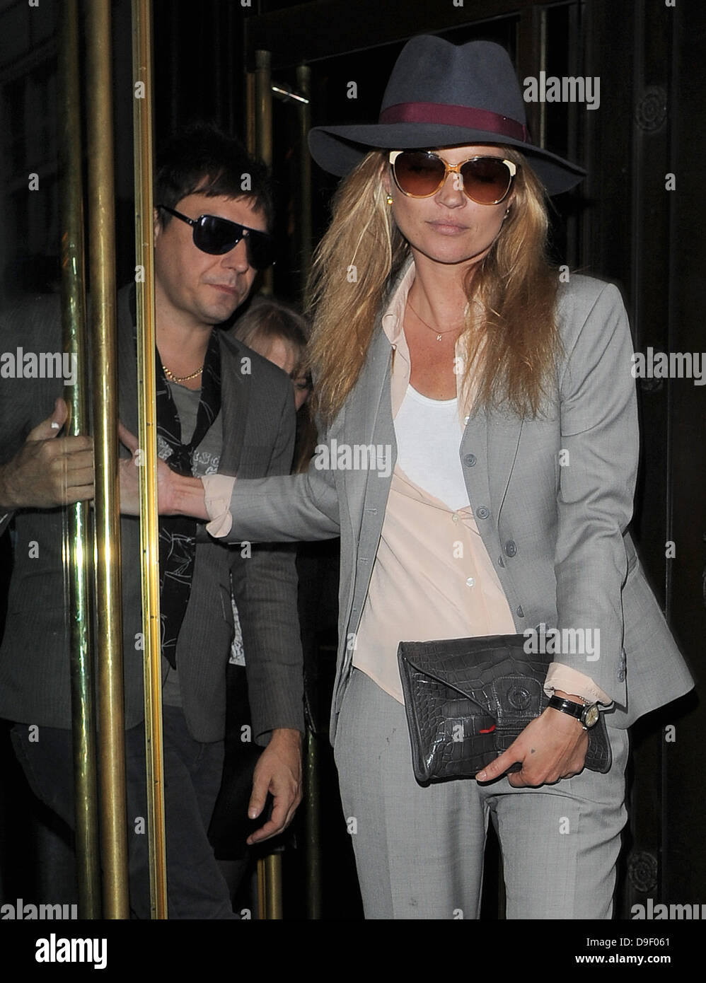 Newly engaged couple Kate Moss and Jamie Hince leave The Wolseley restaurant, having enjoyed a late lunch there with friends. London, England - 23.02.11 Stock Photo