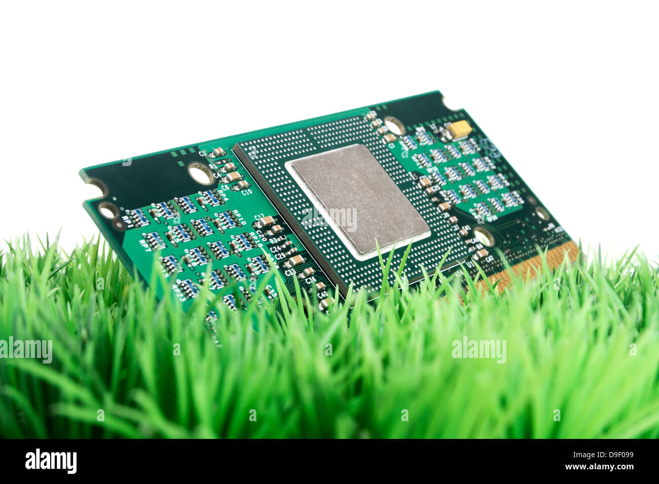 To platinum with processor base on art lawn Board with processor socket on synthetic Grass Stock Photo