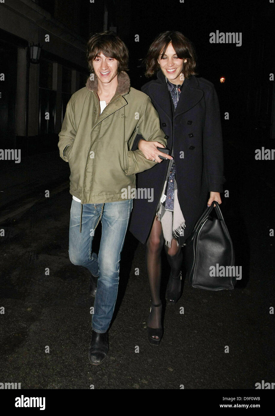 Alex Turner and Alexa Chung Celebrities leave The Ivy Club having earlier  attended the NME Awards 2011 London, England  Stock Photo - Alamy