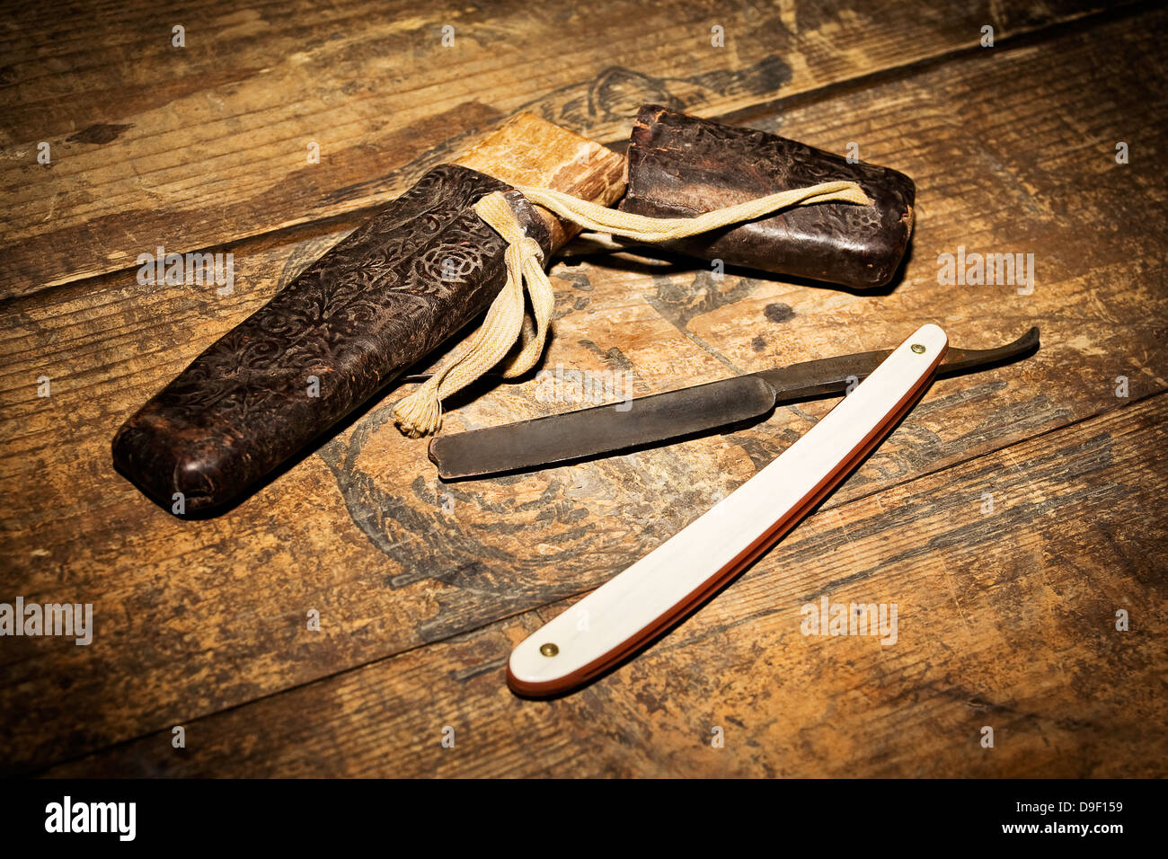 Razor on a wooden box Razor on a wooden punch Stock Photo