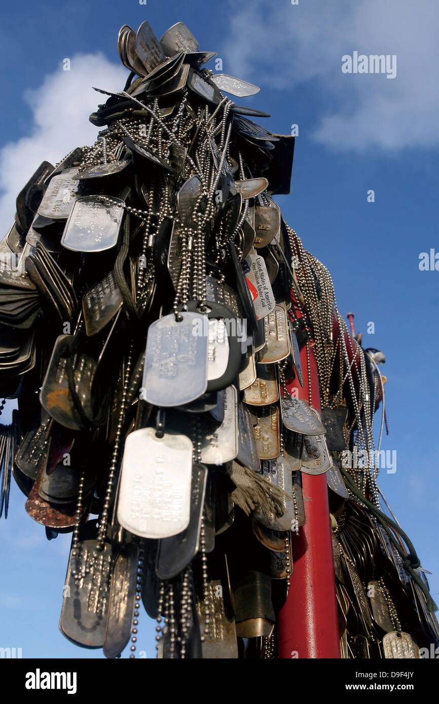 Dog tags from Marines and sailors hang in front of a memorial in Iwo Jima. Stock Photo