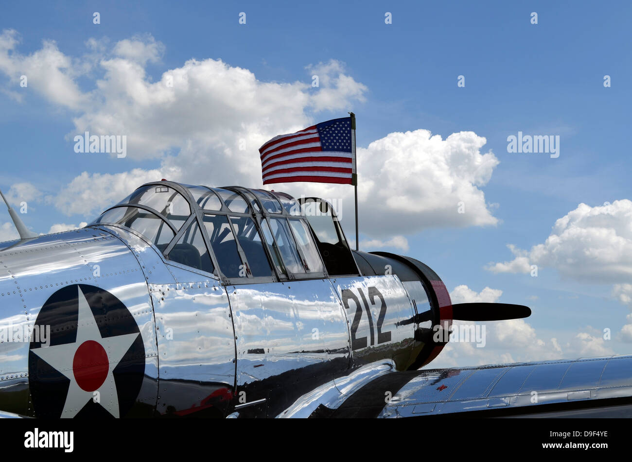 A BT-13 Valiant trainer aircraft with American Flag. Stock Photo