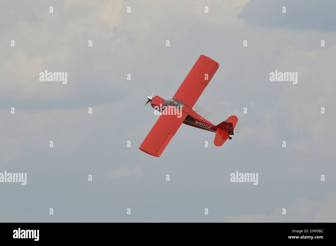 An American Champion 8KCAB Decathlon light aircraft in flight near Lakeland, Florida. Stock Photo