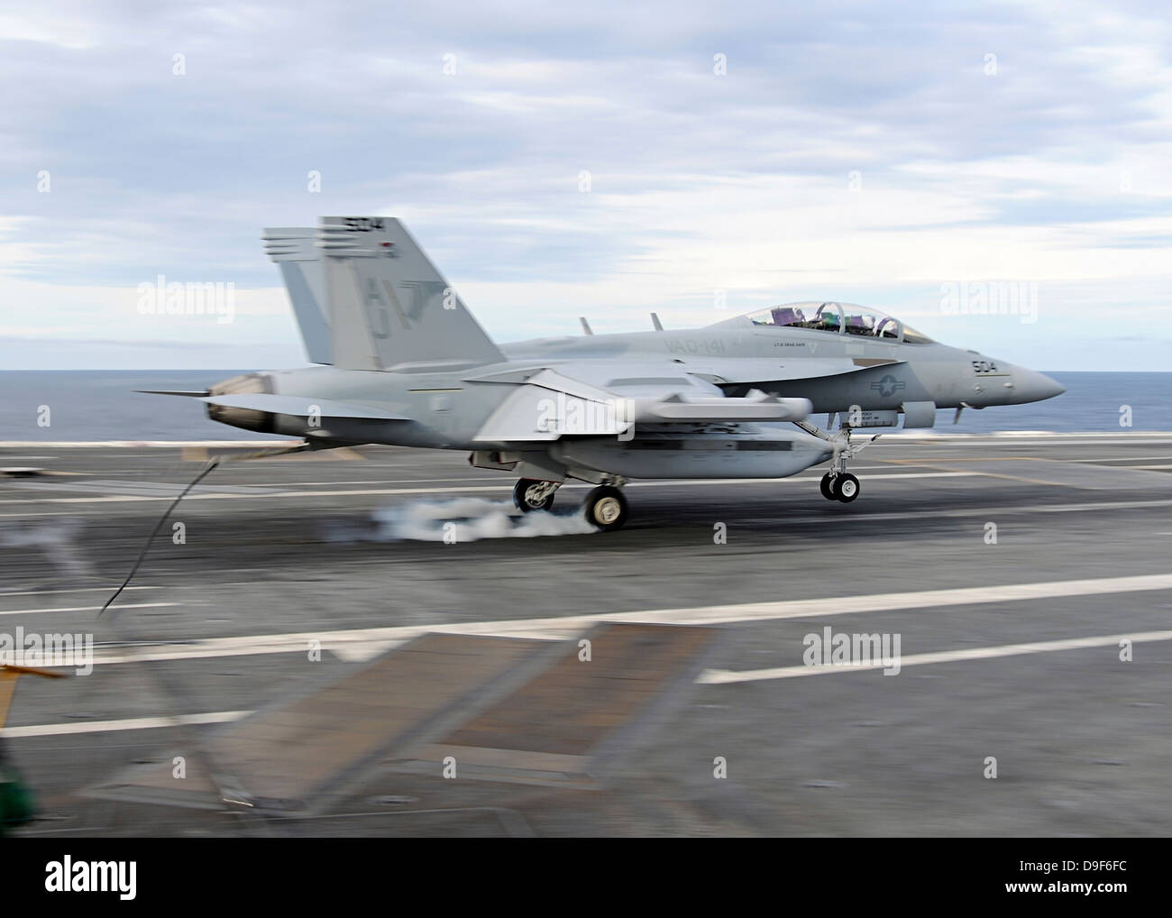 Atlantic Ocean, May 22, 2010 - An E/A-18G Growler makes an arrested landing aboard the aircraft carrier USS George H.W. Bush. Stock Photo