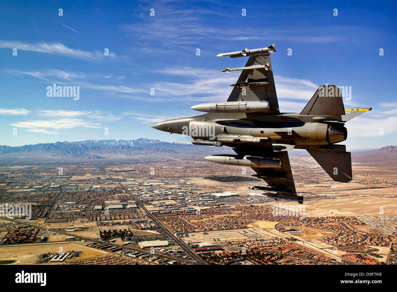 A fighter jet breaks right on a final approach over northern Las Vegas, Nevada. Stock Photo