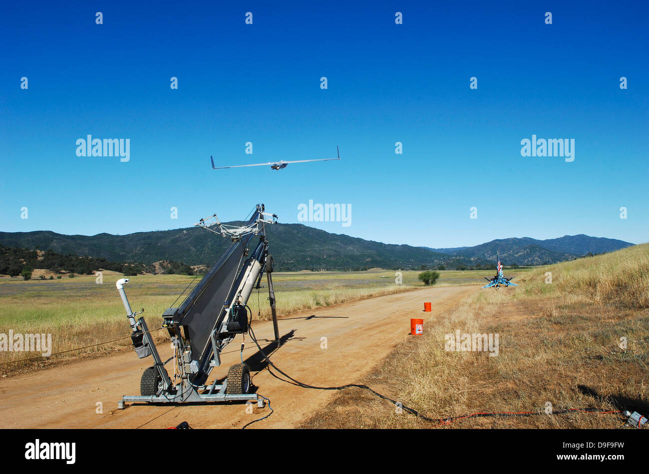 A ScanEagle unmanned aerial vehicle is launched from its catapult. Stock Photo