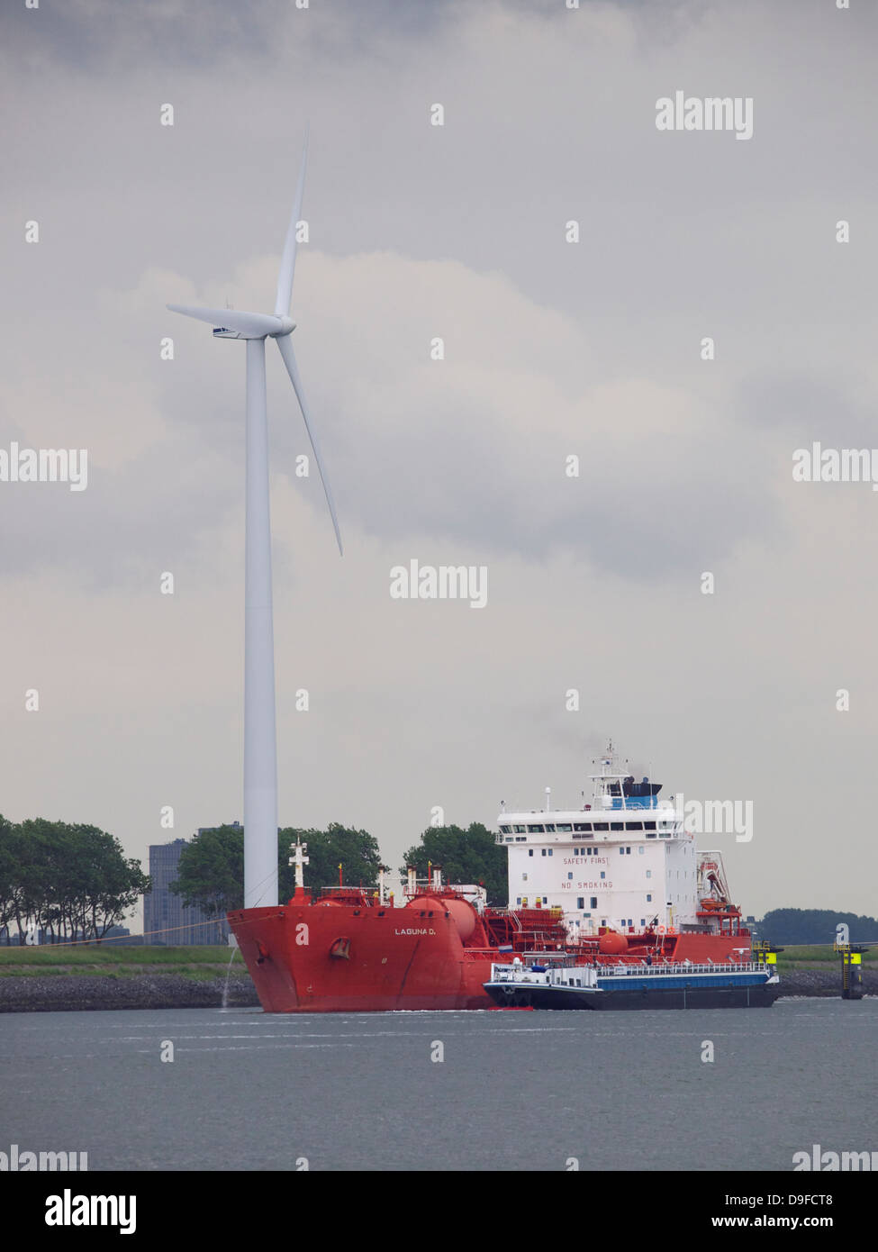Tanker ship with windmill in the port of Rotterdam, the Netherlands Stock Photo