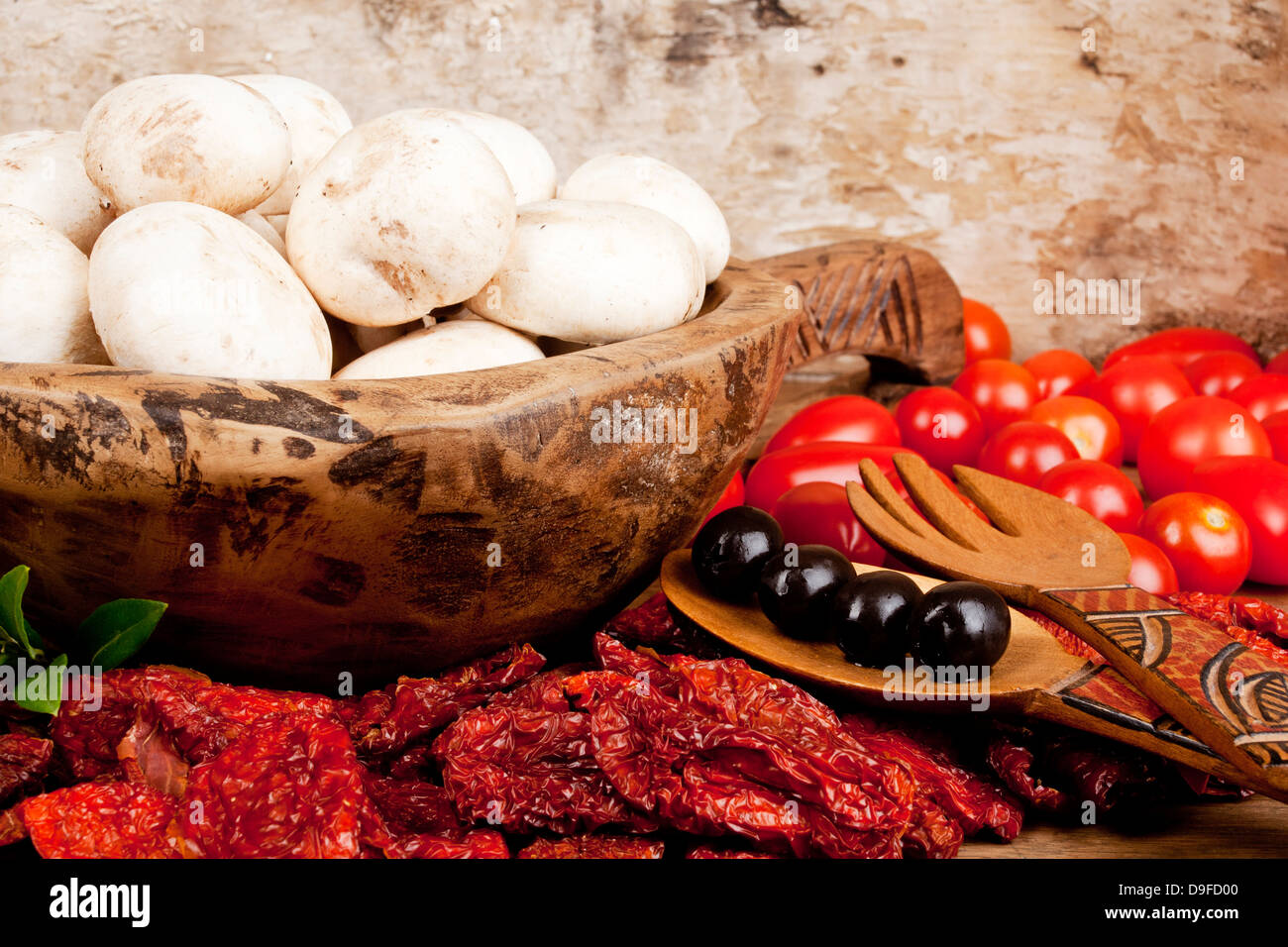 Tomatoes with champions and olive Tomatoes with mushrooms and olive Stock Photo