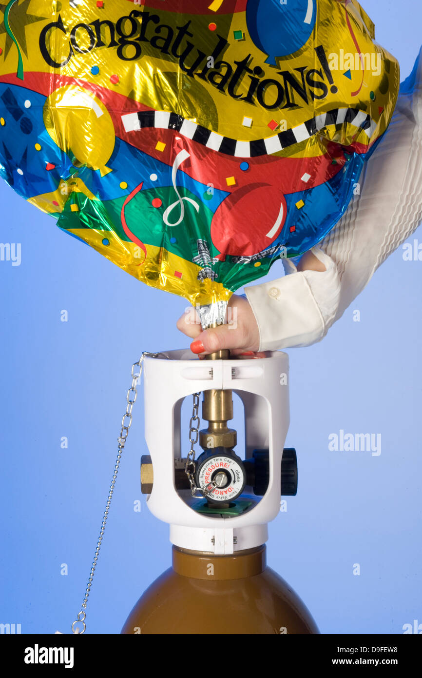 filling Helium party balloons from cylinders Stock Photo Alamy