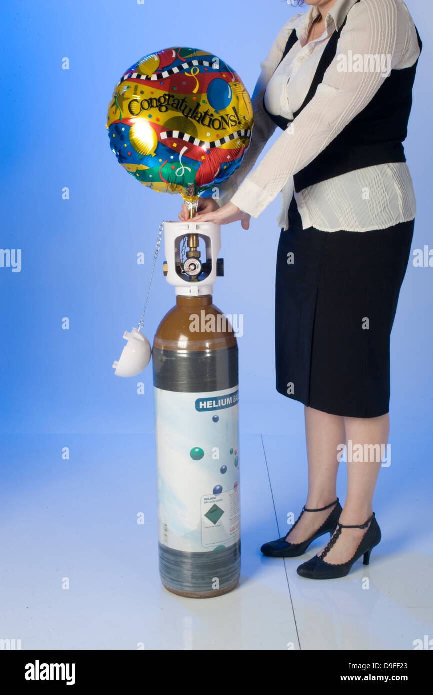 filling Helium party balloons from cylinders Stock Photo Alamy