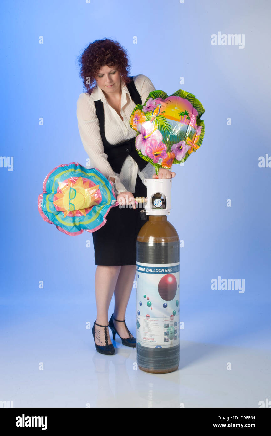 filling Helium party balloons from cylinders Stock Photo Alamy