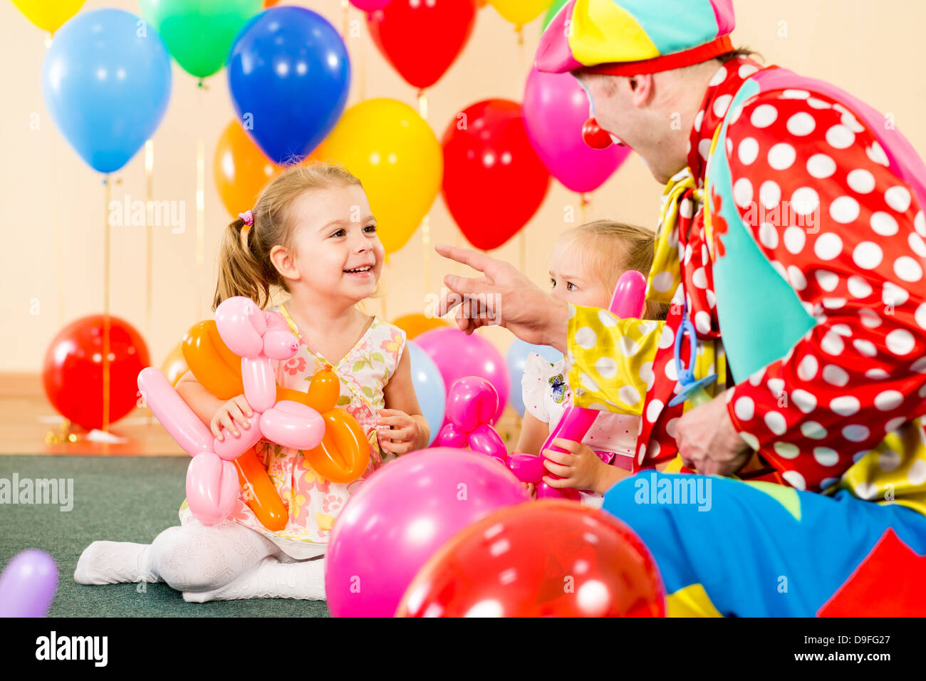 happy kids and clown on birthday party Stock Photo