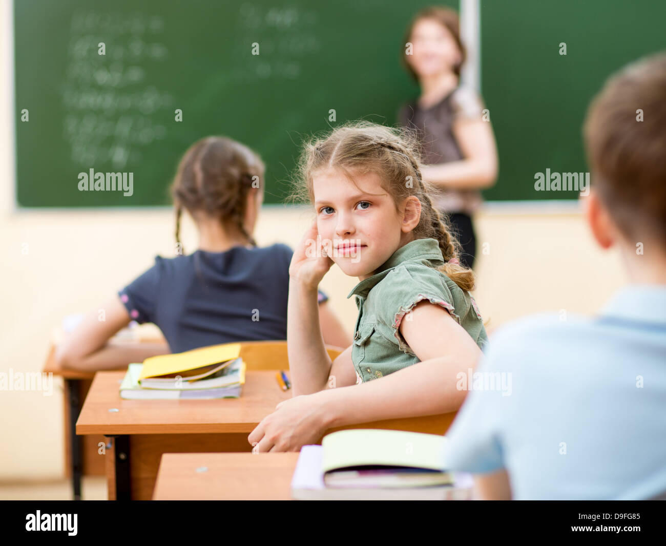 School children in classroom at lesson Stock Photo