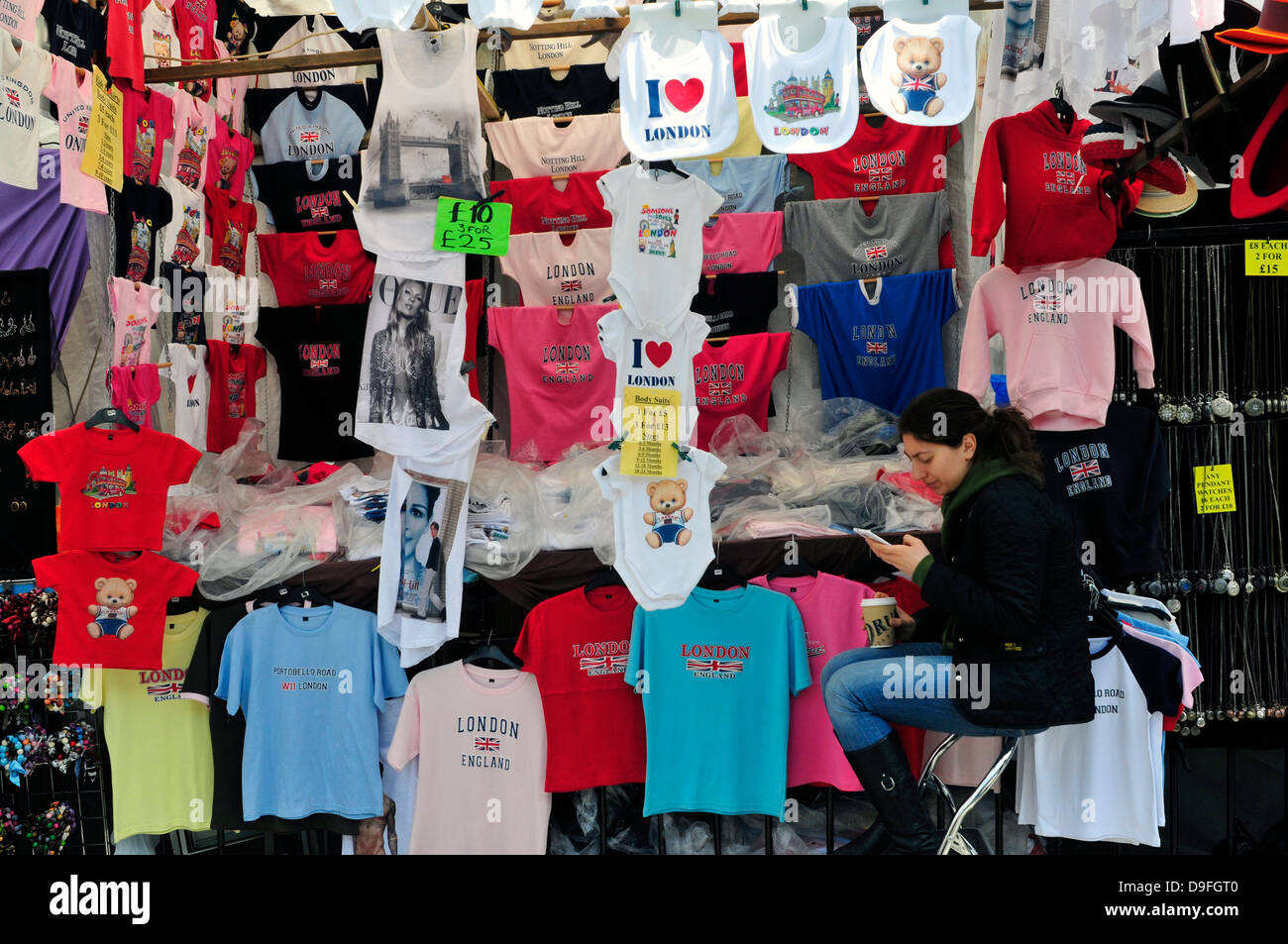 A stall selling souvenir T-shirts, Portobello Road market, London, UK. Stock Photo