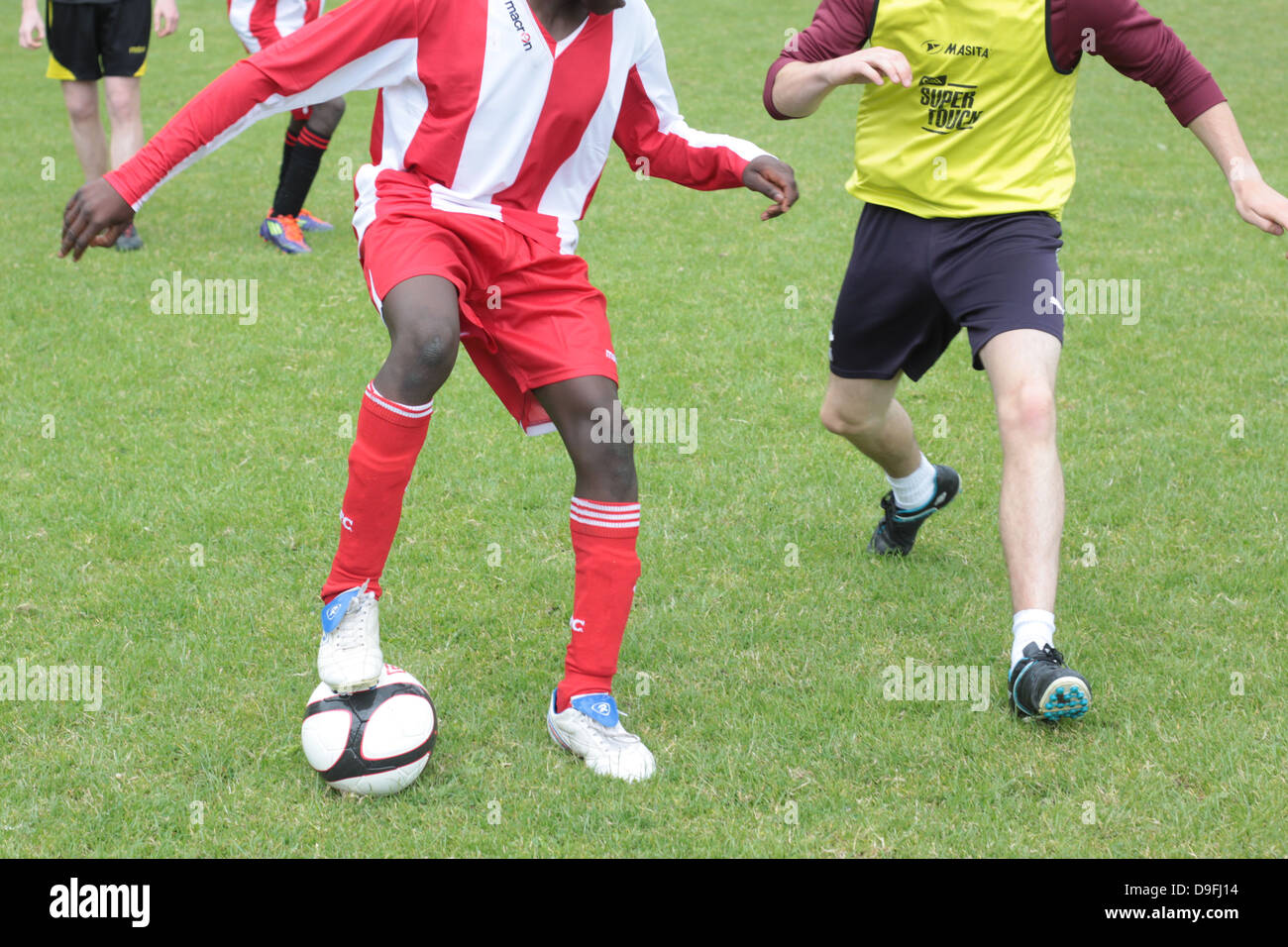 Playing football. Playing soccer. Stock Photo