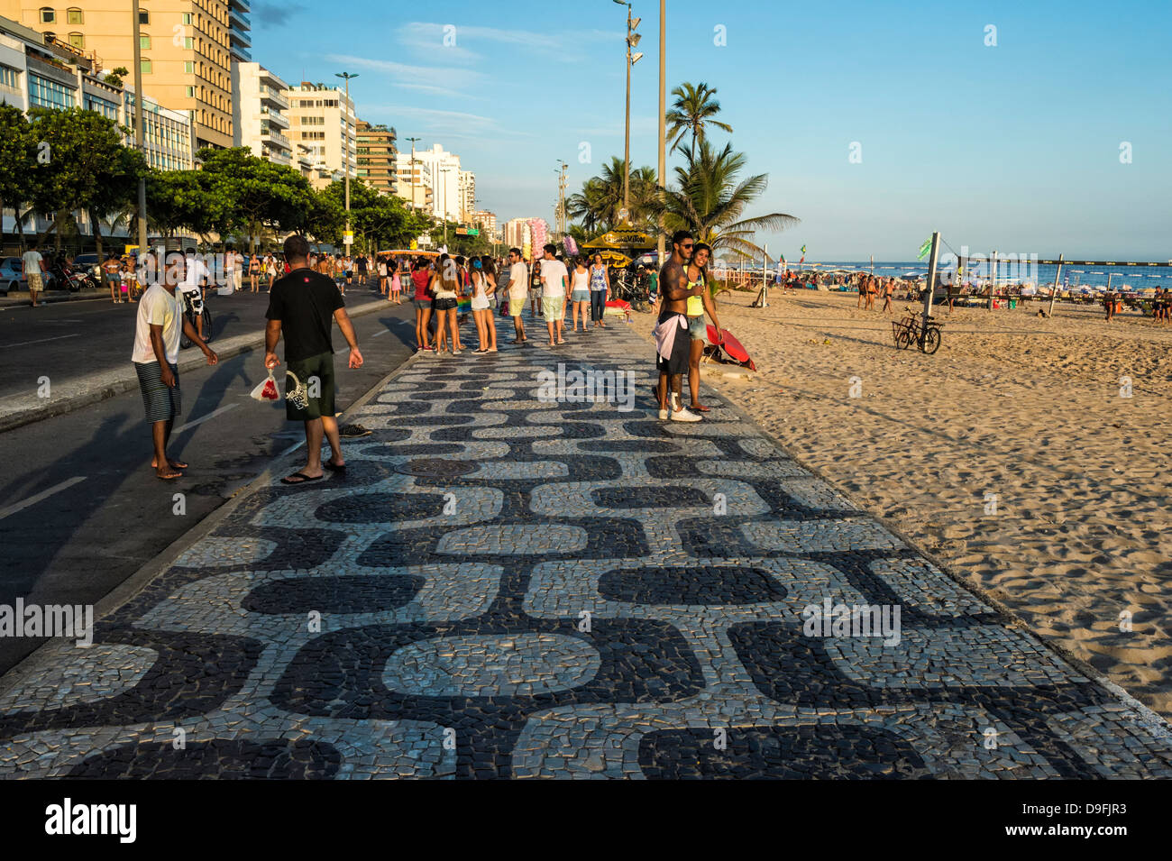 People walking along the sidewalk at Ipanema Beach, Rio de Janeiro, Brazil, South America Stock Photo