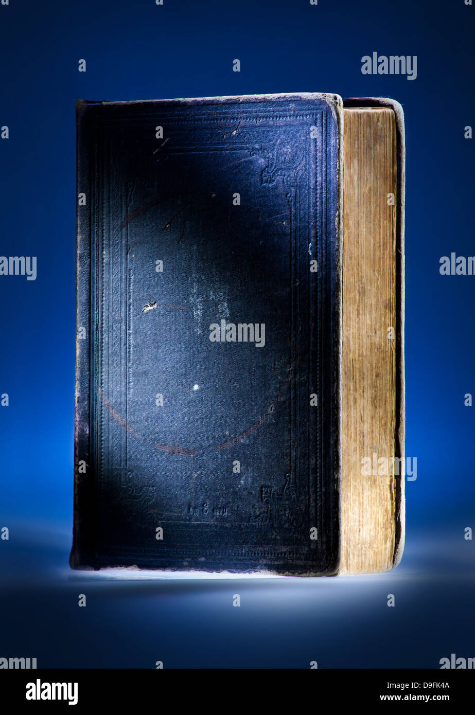 Old book, mystical blue light background Stock Photo