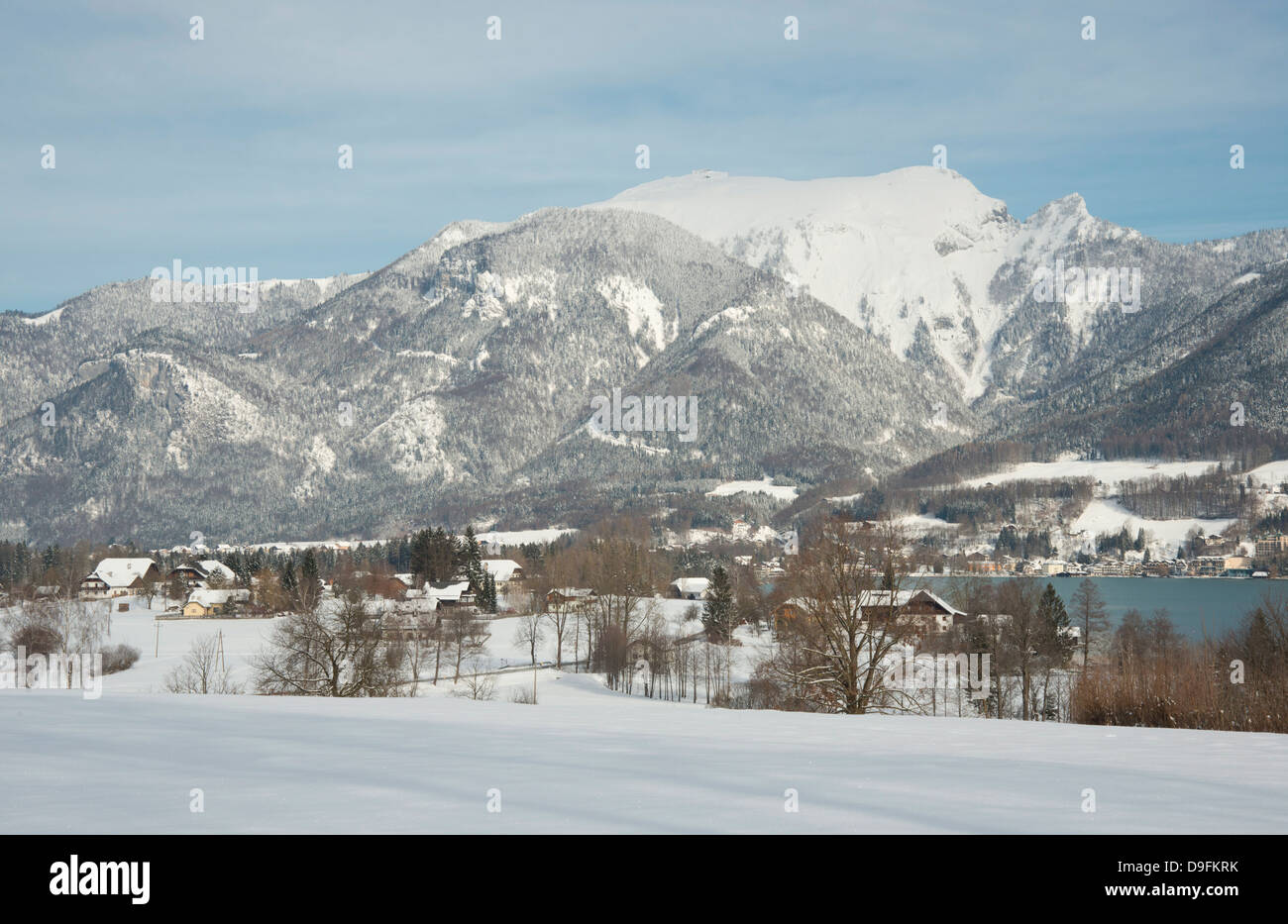 A view of snow covered mountains surrounding St. Wolfgangsee near the town of St. Wolfgang, Austria Stock Photo