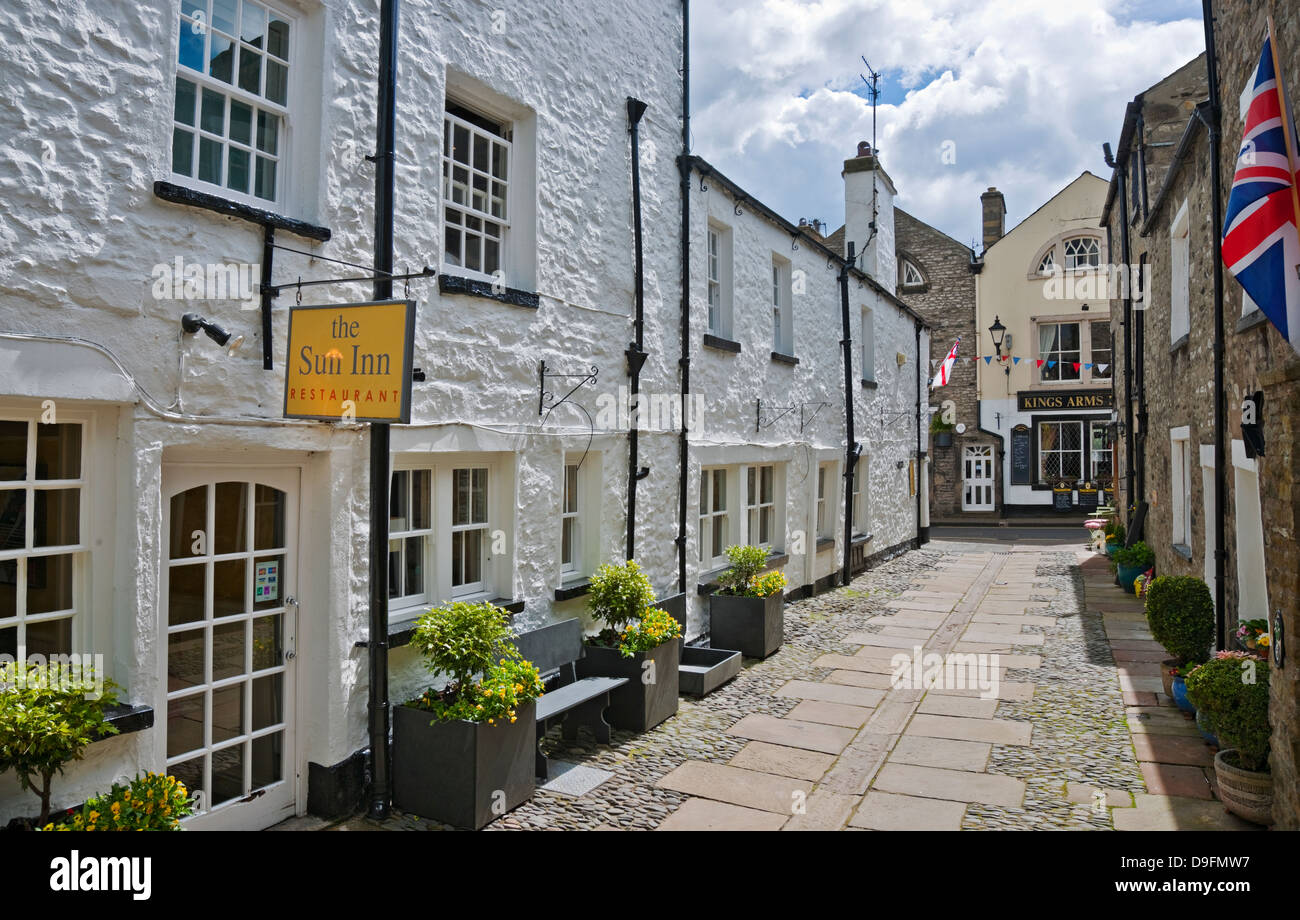 The Sun Inn Restaurant Pub and White Washed village Cottages Church Street Kirkby Lonsdale Cumbria England UK United Kingdom GB Great Britain Stock Photo