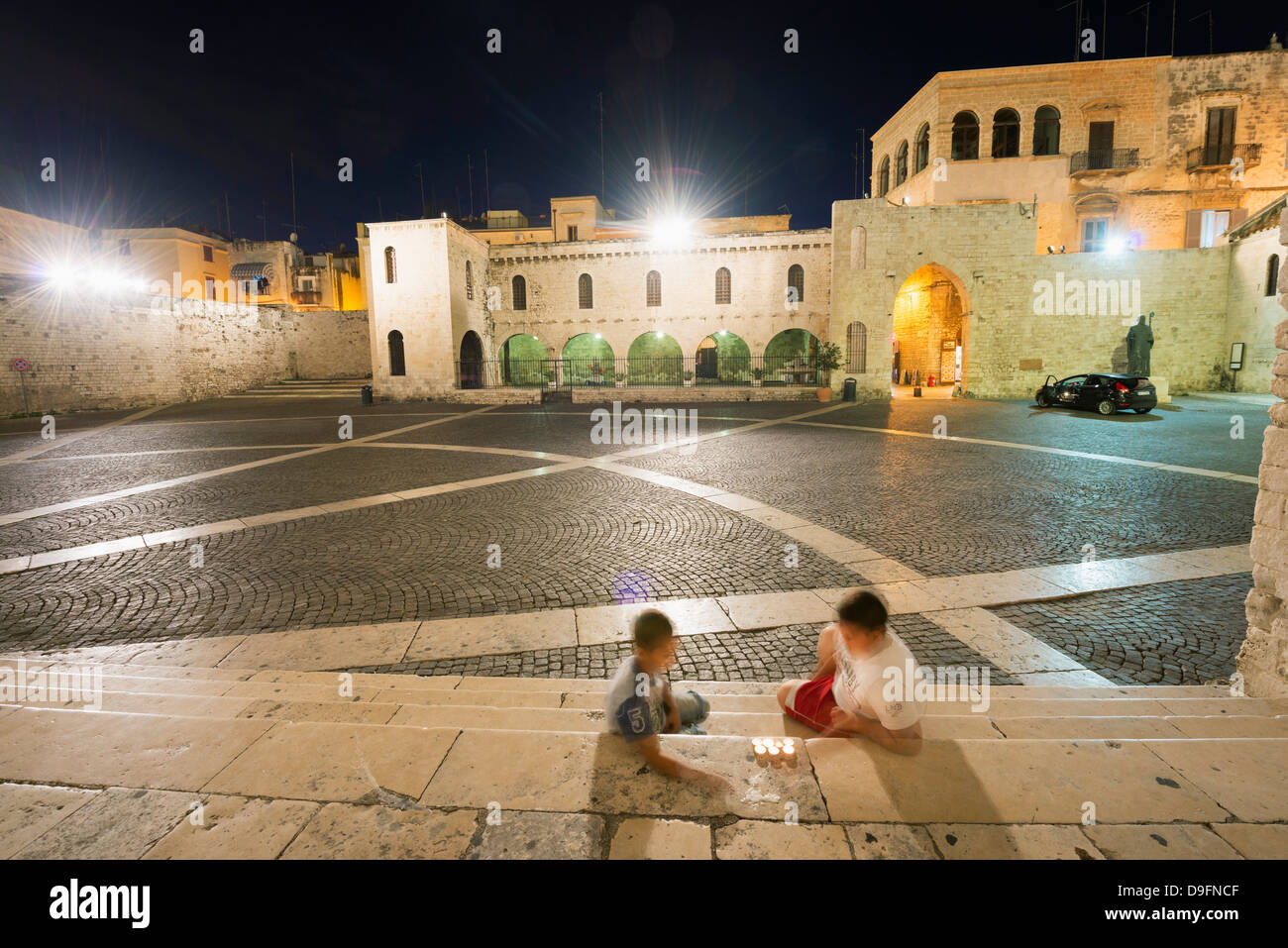 Children outside San Nicola Basilica, Bari, Puglia, Italy Stock Photo