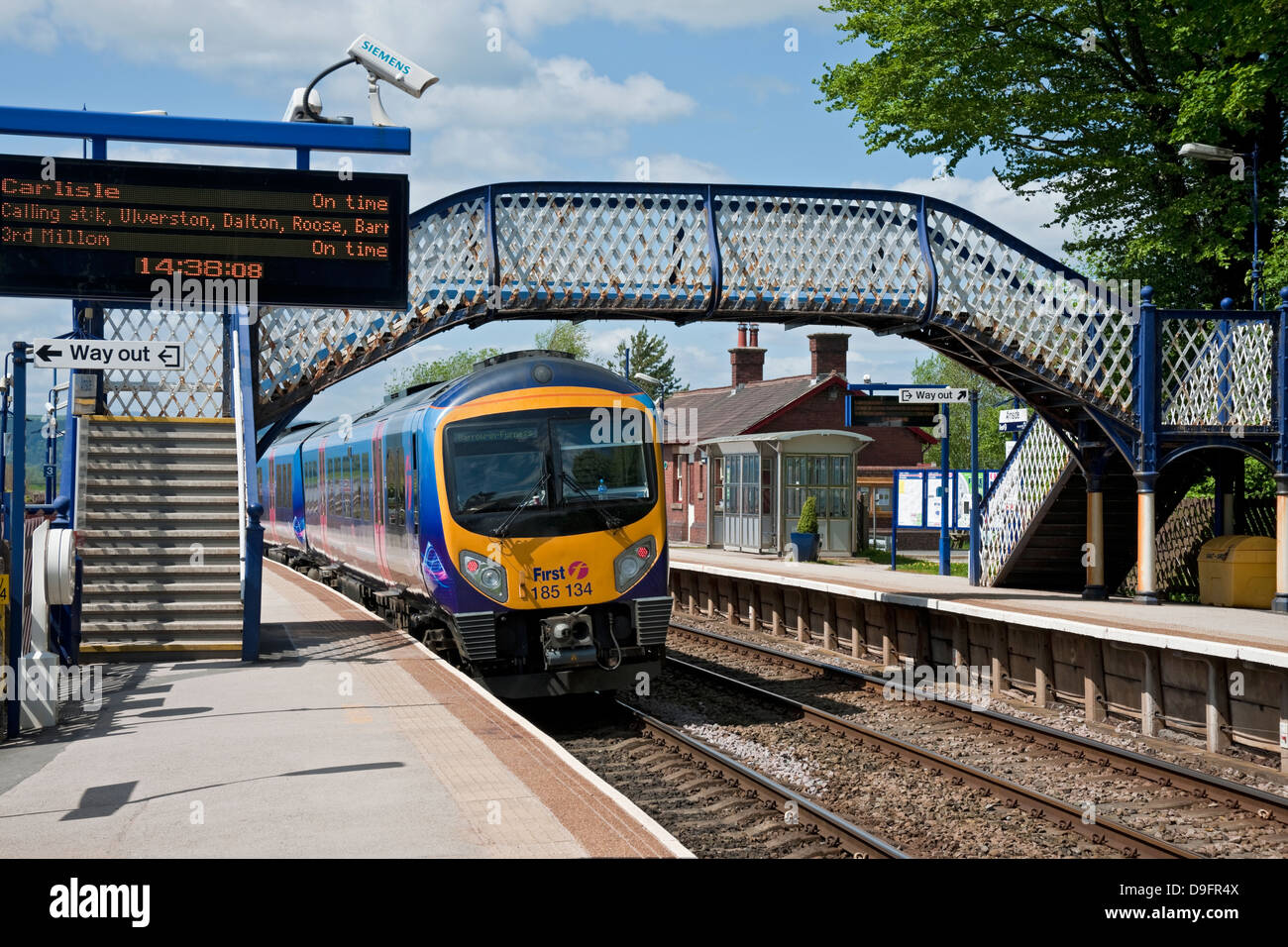 First Train Trans Pennine Express Leaving Arnside Village Railway Station Cumbria England GB Great Britain UK United Kingdom Stock Photo