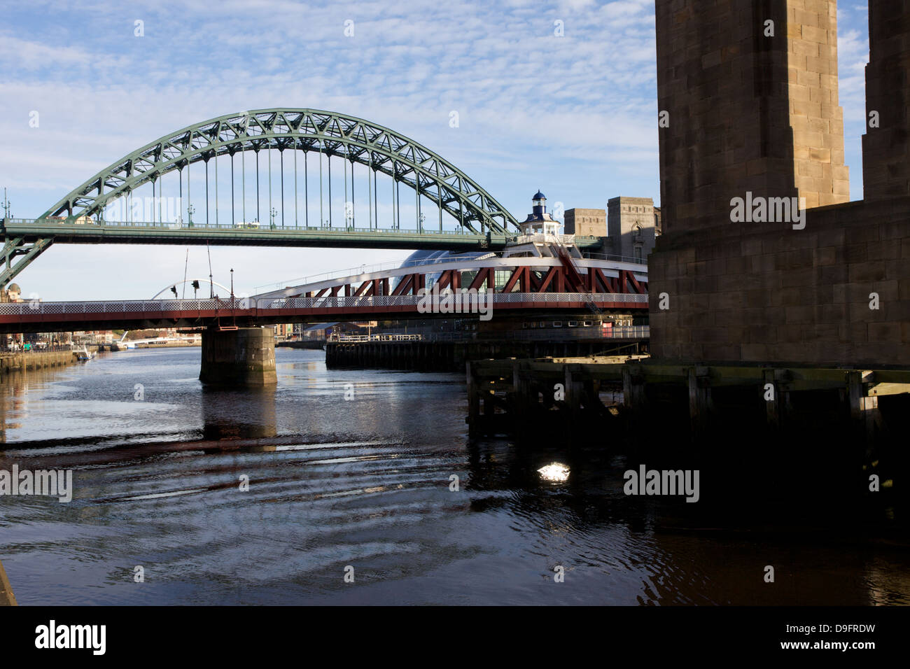A view of the River Tyne which flows through Newcastle Upon Tyne showing the Low Level Bridge and the Tyne Bridge. Stock Photo
