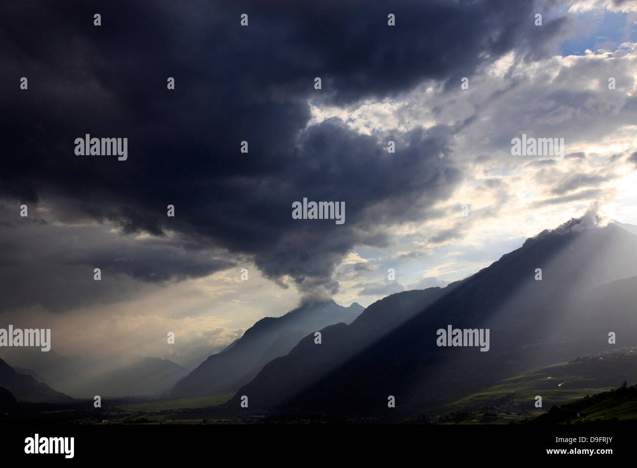 Summer storm clearing over the mountains of the Valais region, Swiss Alps, Switzerland Stock Photo