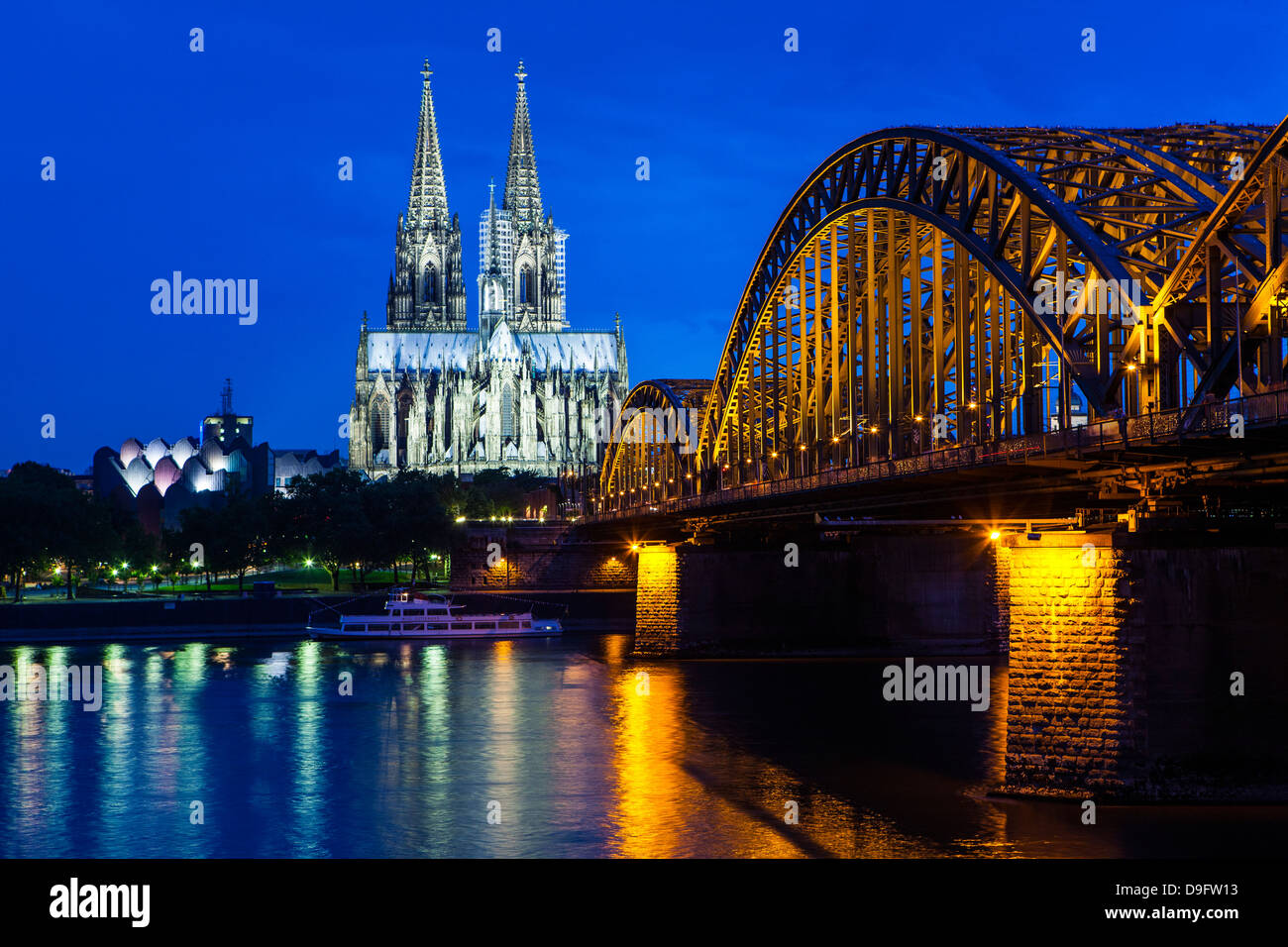 Rhine bridge and Cathedral of Cologne above the River Rhine at night, Cologne, North Rhine-Westphalia, Germany Stock Photo