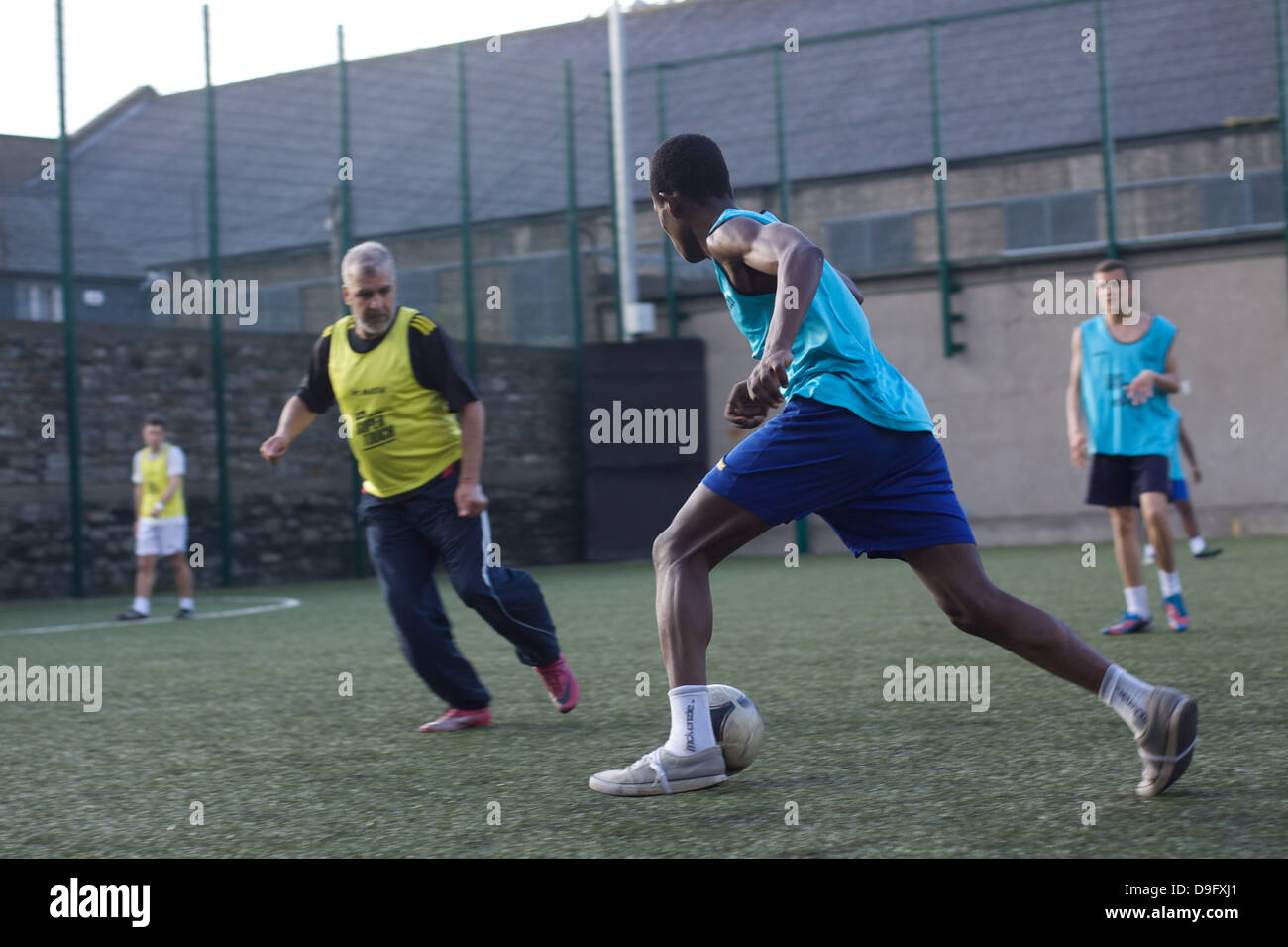 Young men playing football. Playing soccer. Stock Photo