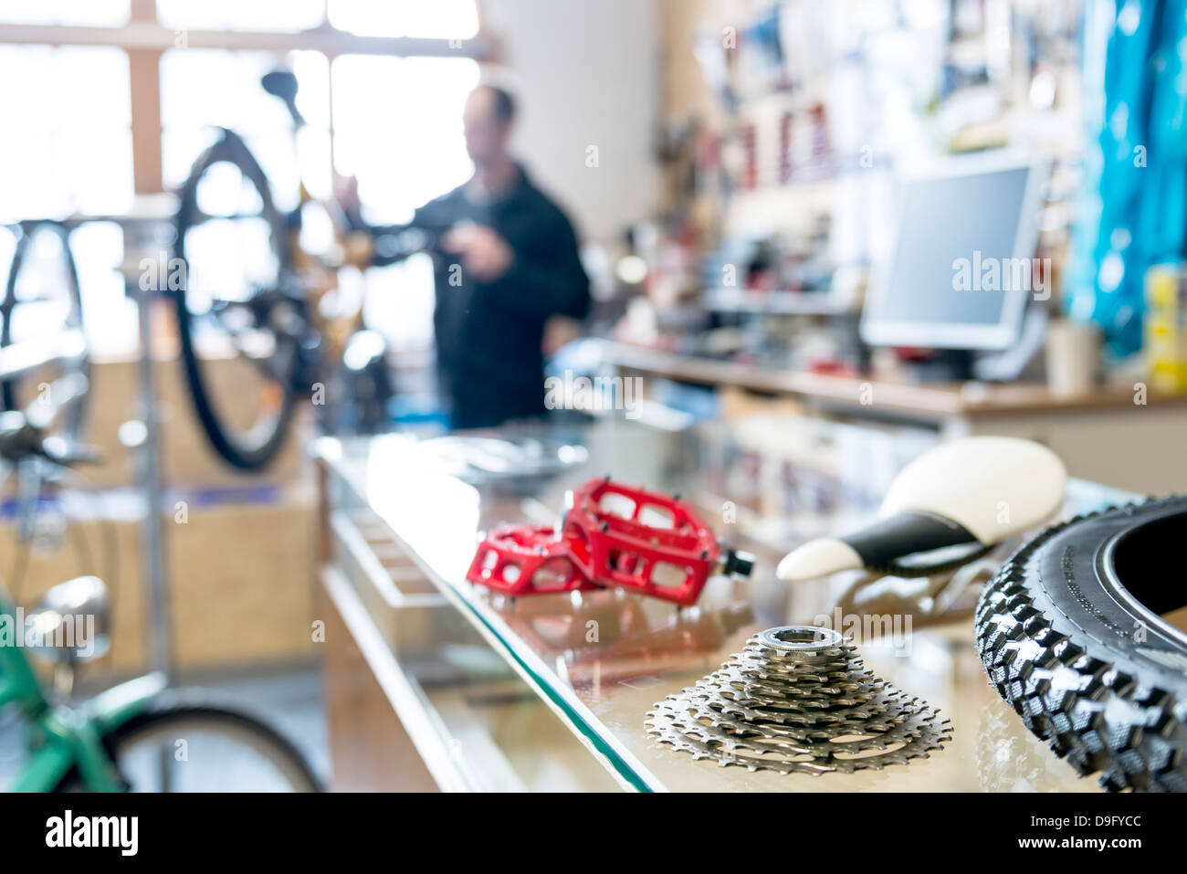 Bicycle mechanic at work in Bike Shop Stock Photo Alamy