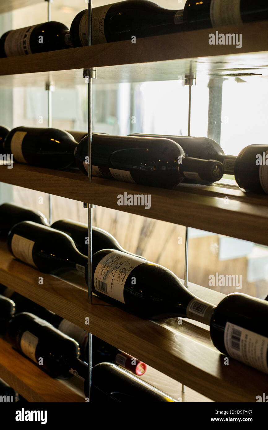 Wine bottles in racks Stock Photo - Alamy