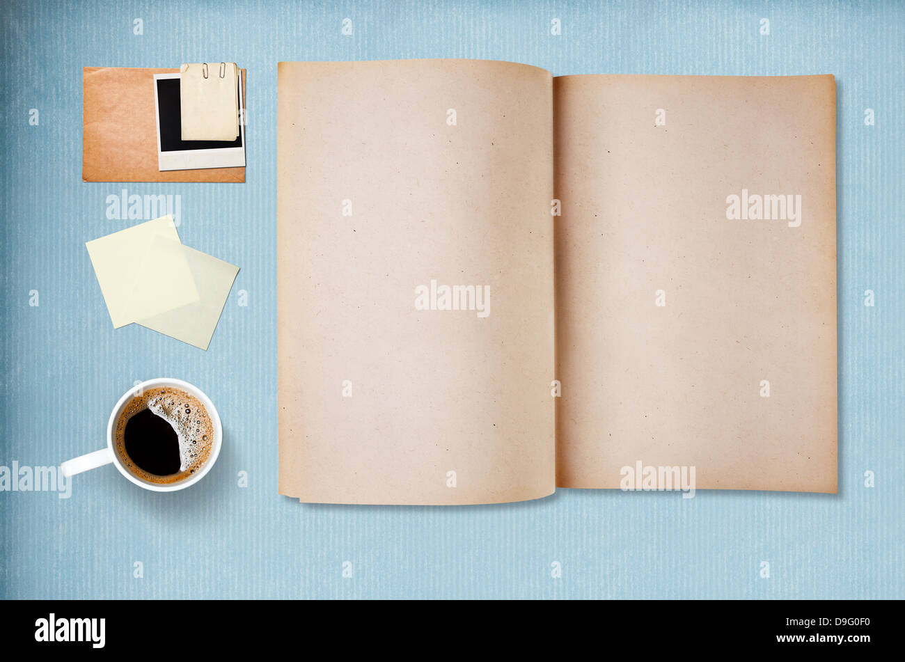 Coffee cup, note paper and notebook, vintage blue paper on background Stock Photo