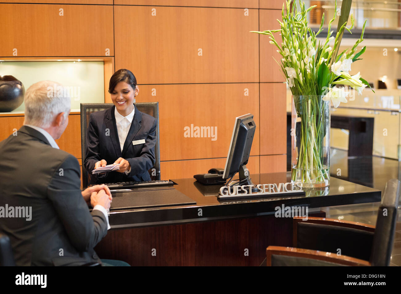 Businessman woman sitting reception desk hires stock photography and