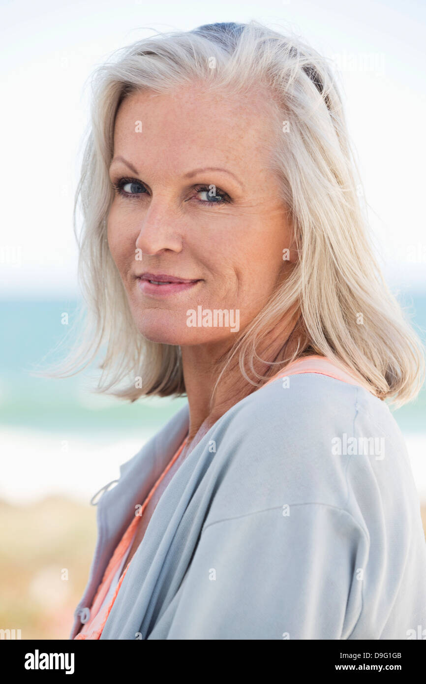 Portrait of a woman smiling on the beach Stock Photo - Alamy