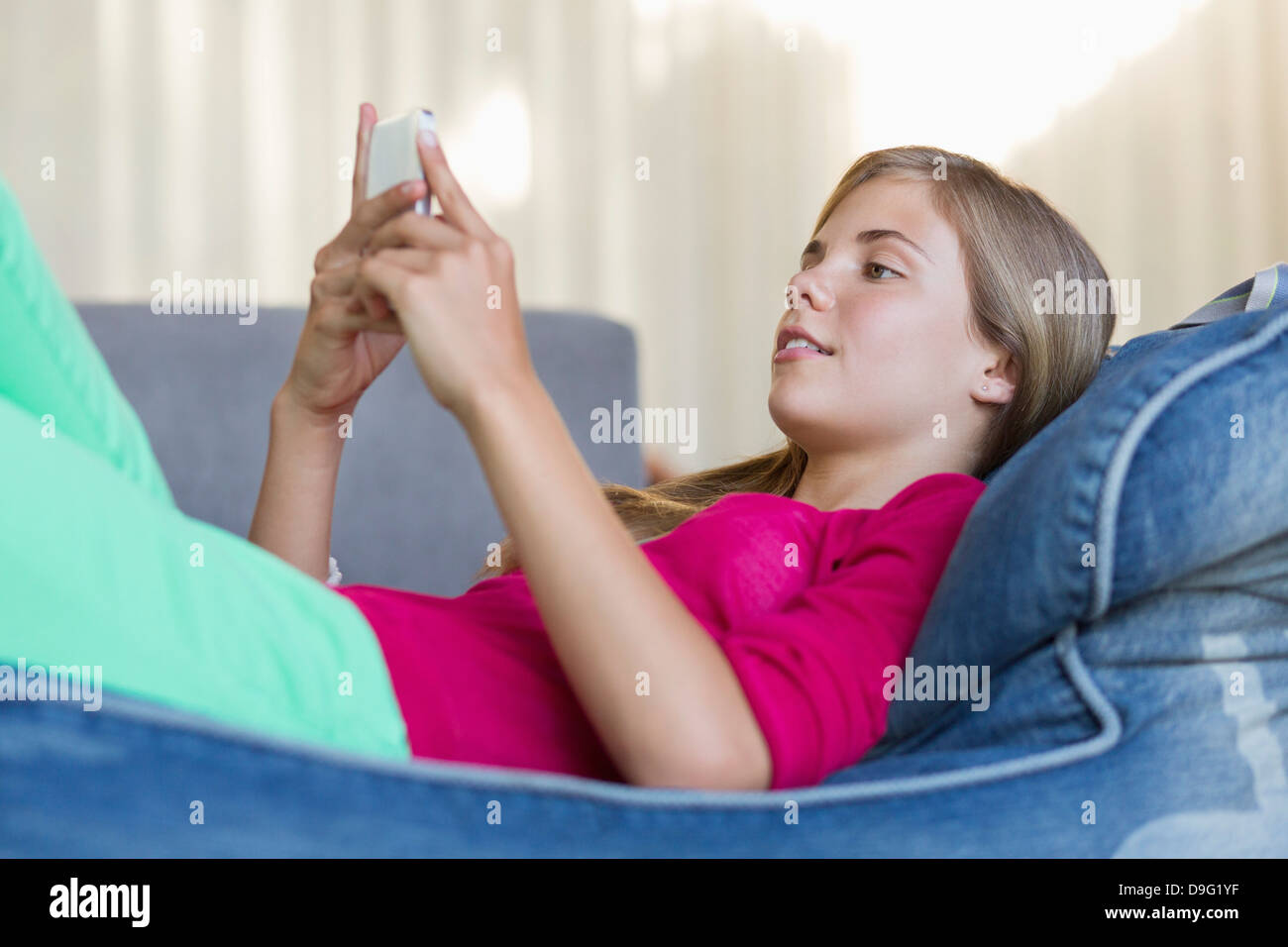 Girl lying on bean bag hi-res stock photography and images - Alamy