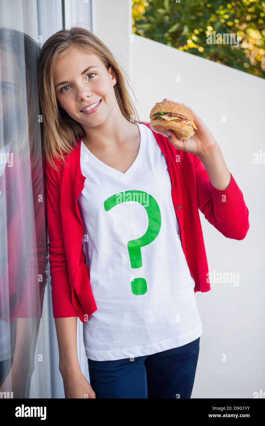 Girl holding a hamburger Stock Photo