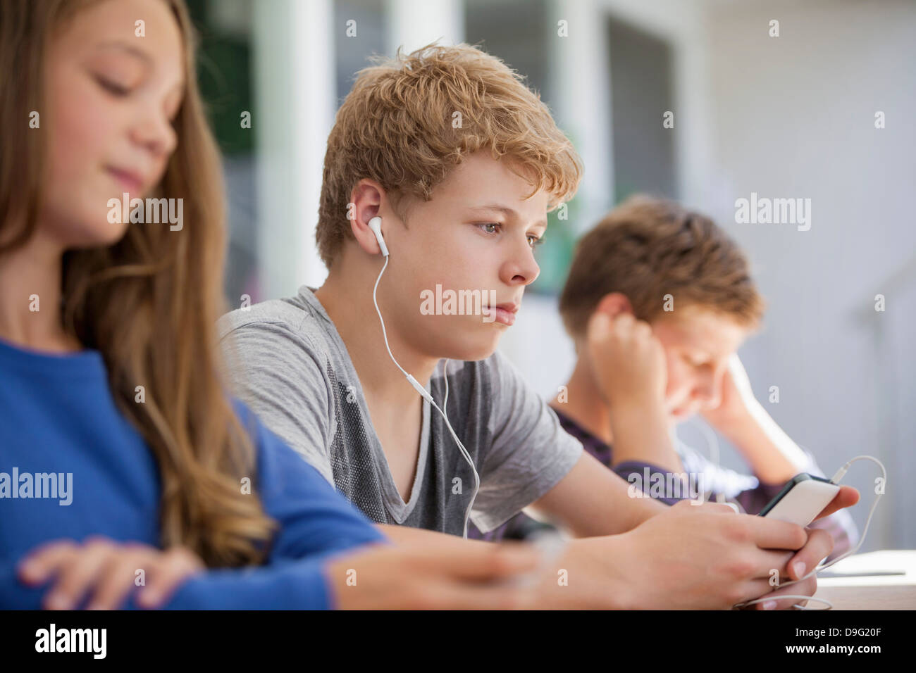 Students using electronic gadget in a classroom Stock Photo Alamy