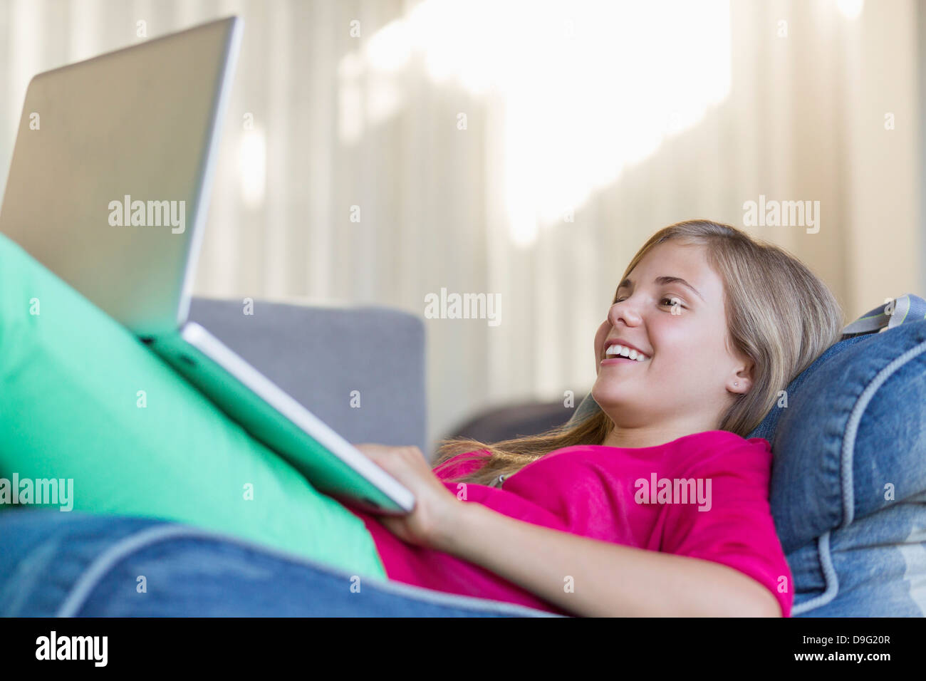 Girl lying on bean bag hi-res stock photography and images - Alamy